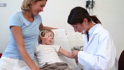 Child looking at his bandage