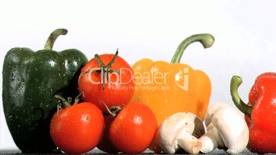 Water drops falling in super slow motion vegetables and mushrooms