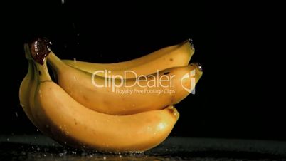 Delicious bananas in super slow motion being soaked