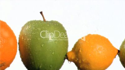 Fruits being watering in super slow motion