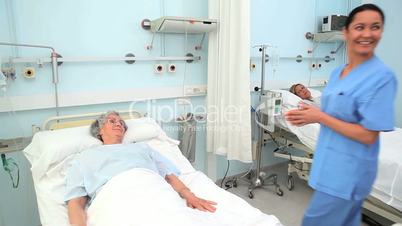 Doctor and nurse talking to a patient