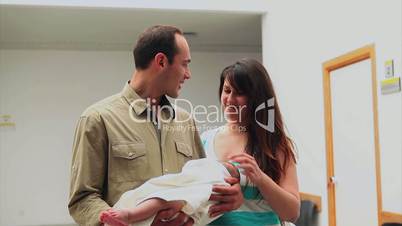 Happy couple with a newborn baby