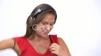 Woman wearing a headphone while dancing