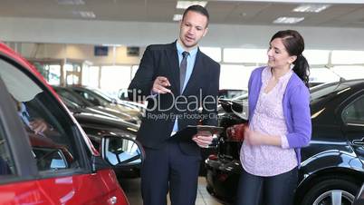 Businessman showing a car