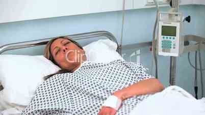 Female patient sleeping on a medical bed