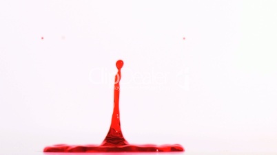 Splash of red liquid in super slow motion