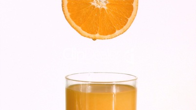 Orange in super slow motion making juice