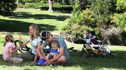 Family sitting in a park