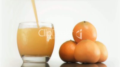 Citrus smoothie poured in super slow motion