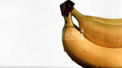 Bananas in super slow motion being soaked