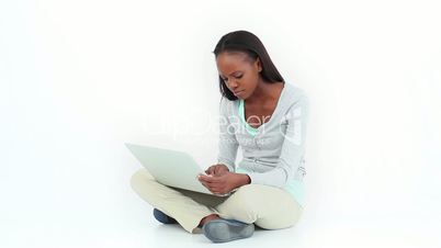 Angry woman typing on a computer