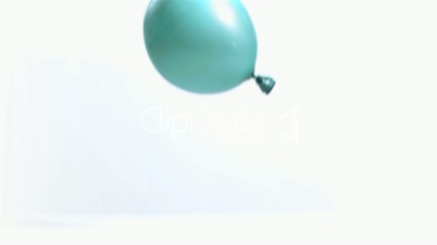 Super slow motion of a light blue balloon