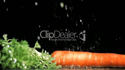 Delicious carrot in super slow motion being wet