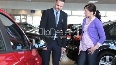 Businessman presenting a car