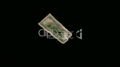 Dollar notes in super slow motion flying