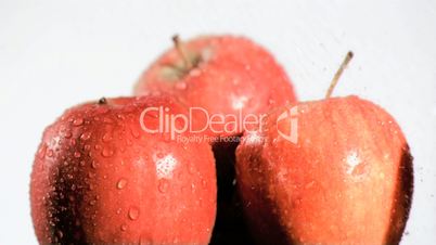 Water sprayed in super slow motion on apples