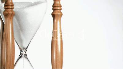 Sand flowing in super slow motion from a hourglass