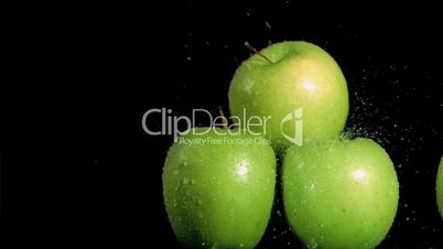 Water sprayed on apples in super slow motion