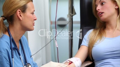 Nurse smiling to a blood donor