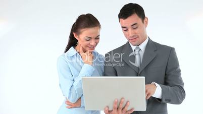 Business people holding a laptop