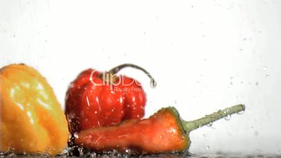 Vegetables in super slow motion being soaked
