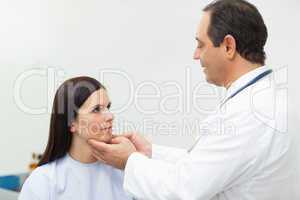 Doctor auscultating the neck of a patient