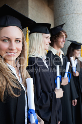 Portrait of a blonde graduate with blue eyes