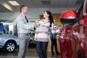 Smiling salesman talking with a woman