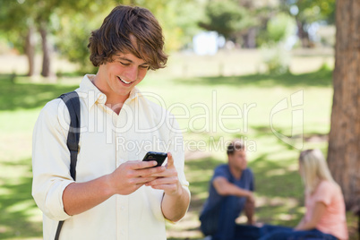 Close-up of a young man using a smartphone