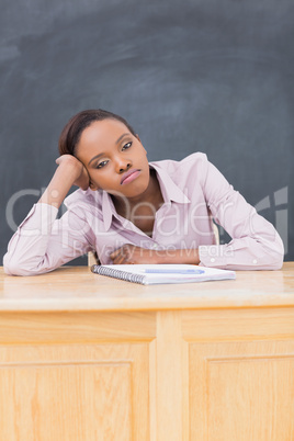 Sad black woman at desk