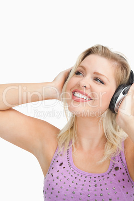 Cheerful woman wearing headphones