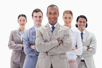 Close-up of a business team smiling and crossing their arms
