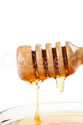 Honey trickle on the top of a honey full bowl