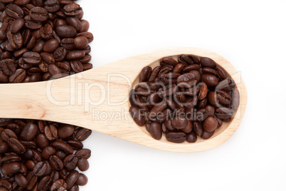 Wooden spoon with coffee seeds