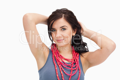 Brunette wearing a red bead necklace