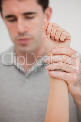 Close-up of a hand being stretched