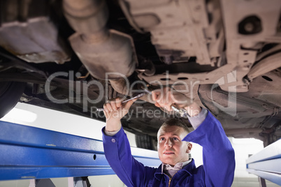 Mechanic using tools