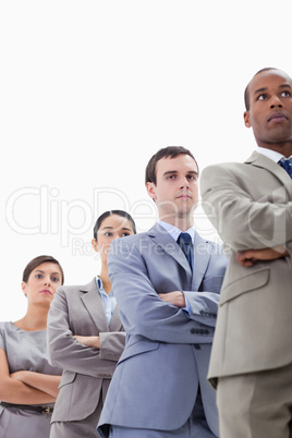 Close-up of a low-angle shot of colleagues crossing their arms i