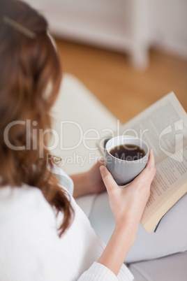 High view of a woman holding a mug coffee