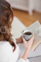 High view of a woman holding a mug coffee