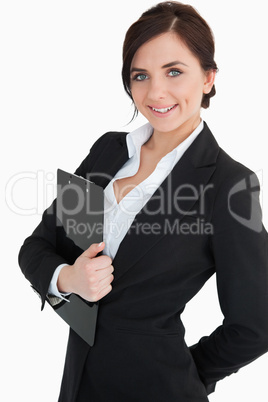 Happy businesswoman holding a clipboard