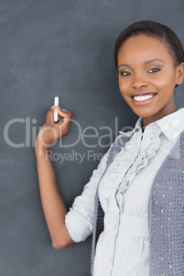 Black teacher looking at camera while smiling