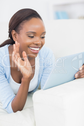 Black woman lying on front while smiling