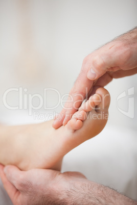 Physiotherapist offering a foot massage