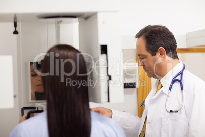 Doctor conducting a mammography on a patient