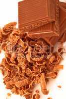 Close up of pile of chocolate pieces and chocolate shavings