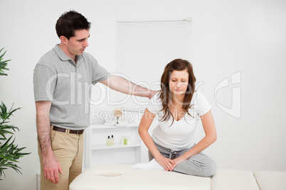 Peaceful woman doing stretching exercises with a doctor
