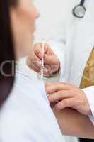 Close up of a doctor doing an injection to a patient
