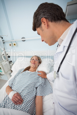 Doctor touching the shoulder of his patient