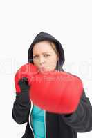 Concentrated woman boxing